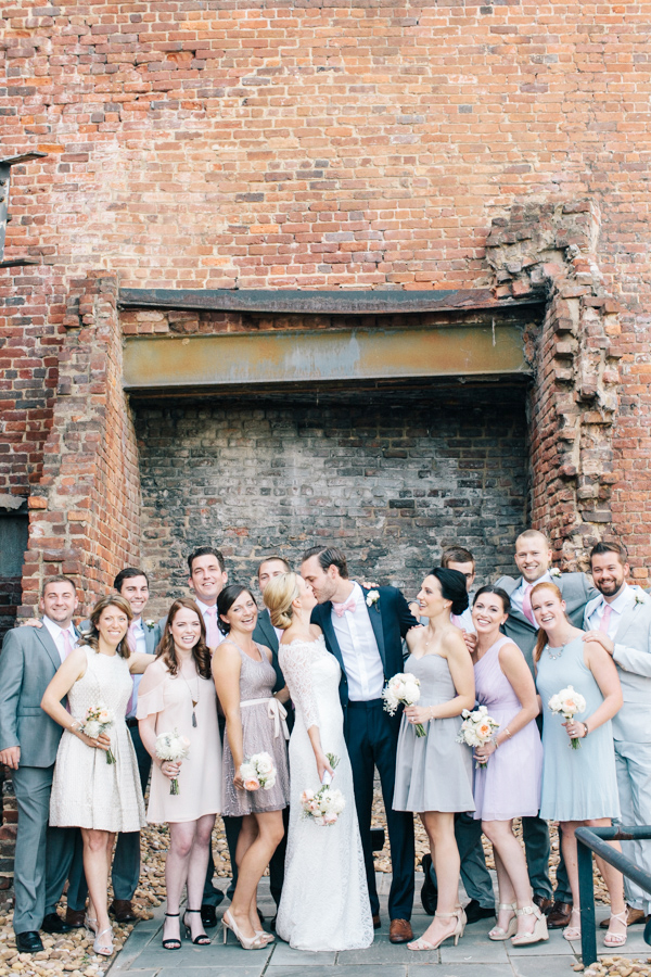 Bridal party outside brick building