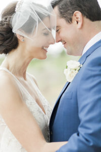Bride and groom touch foreheads