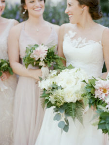 bridal and bridesmaids holding flowers