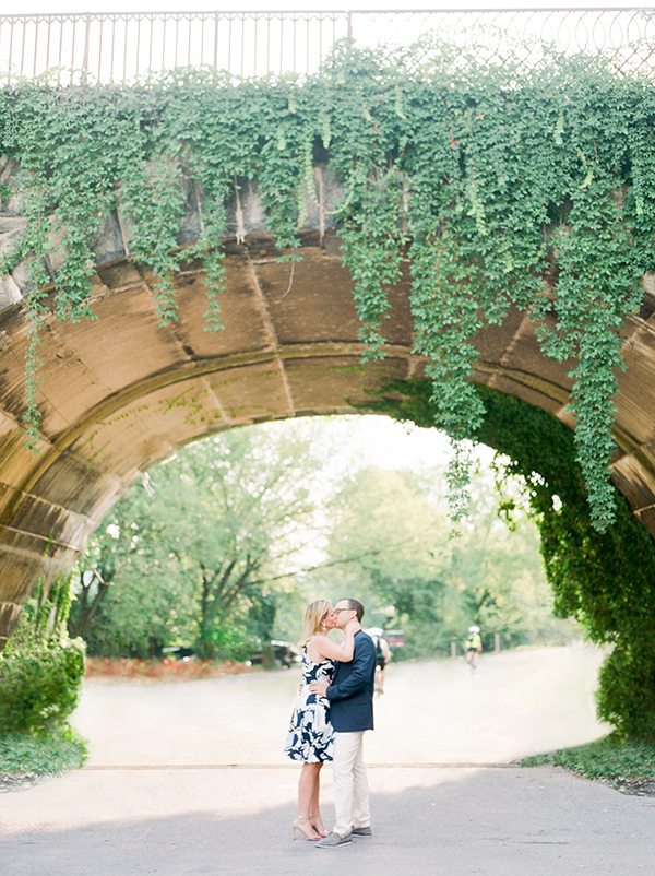 Couple kiss under archway