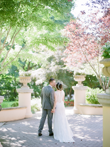 Bride and Groom Kissing in DC courtyard