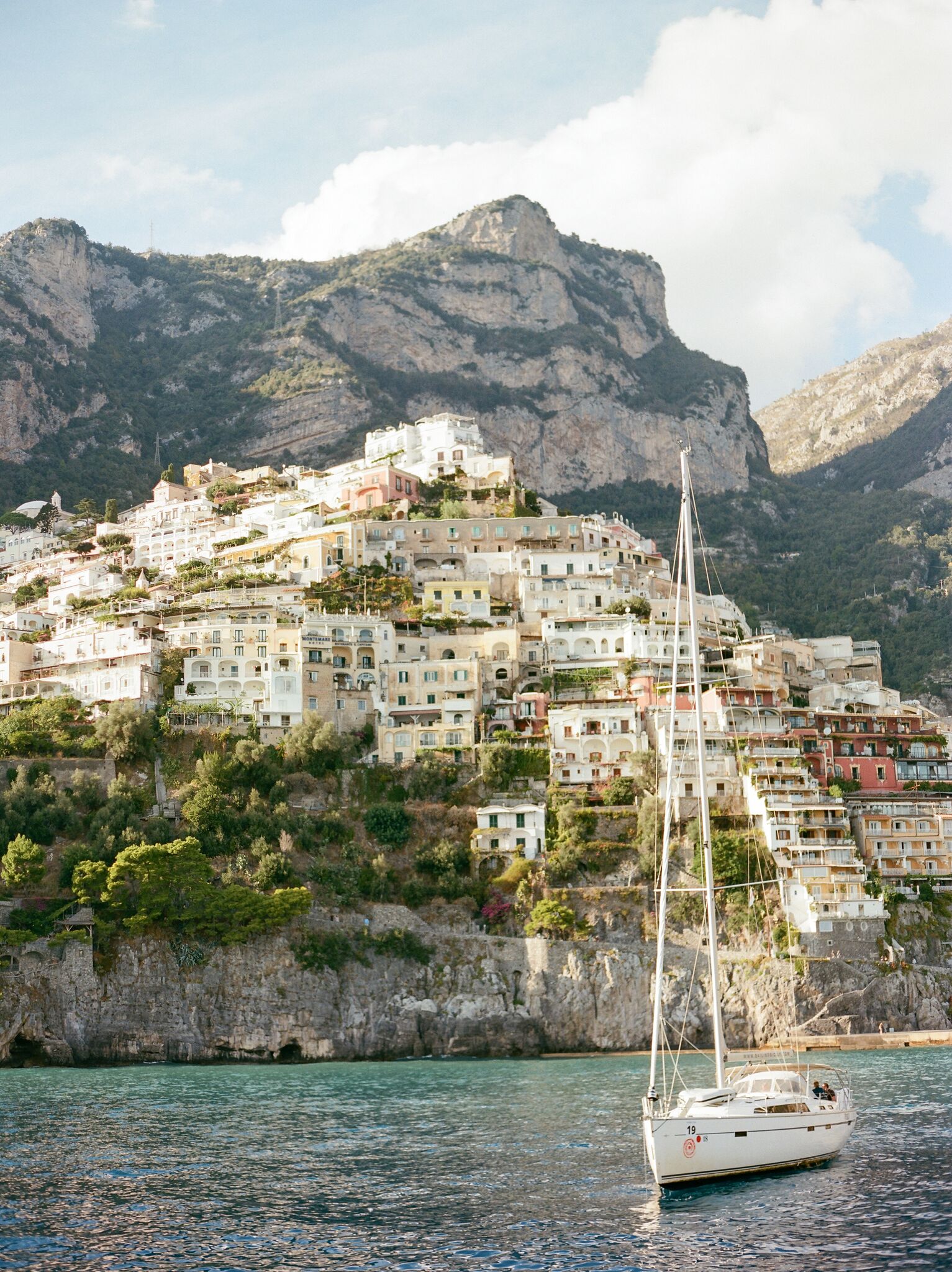 Amalfi Coast sailboat and buildings