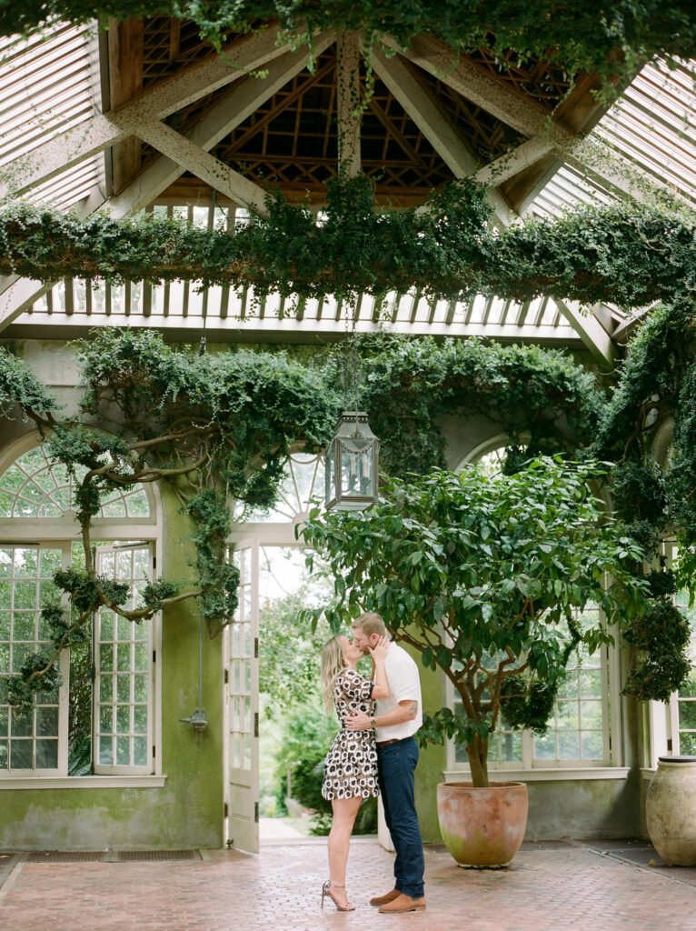 Couple kissing in courtyard