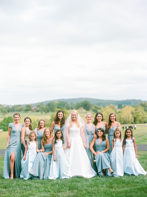bride with bridesmaid and flower girls