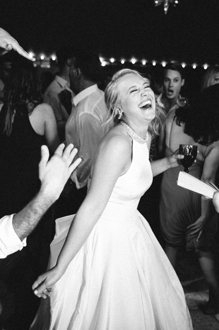 bride laughing and dancing
