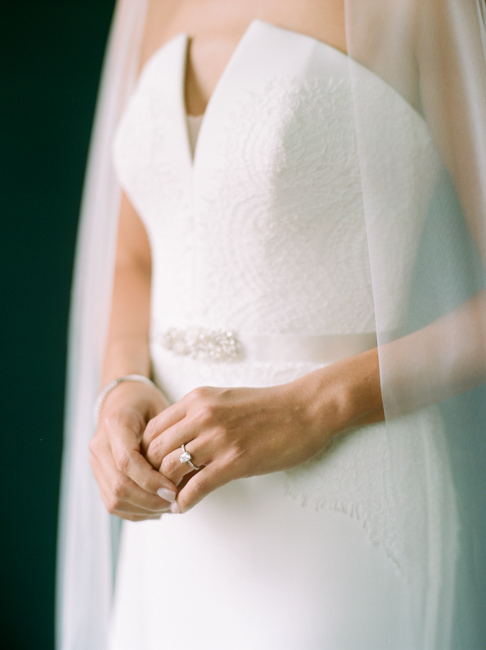 bride holding her hands showing ring