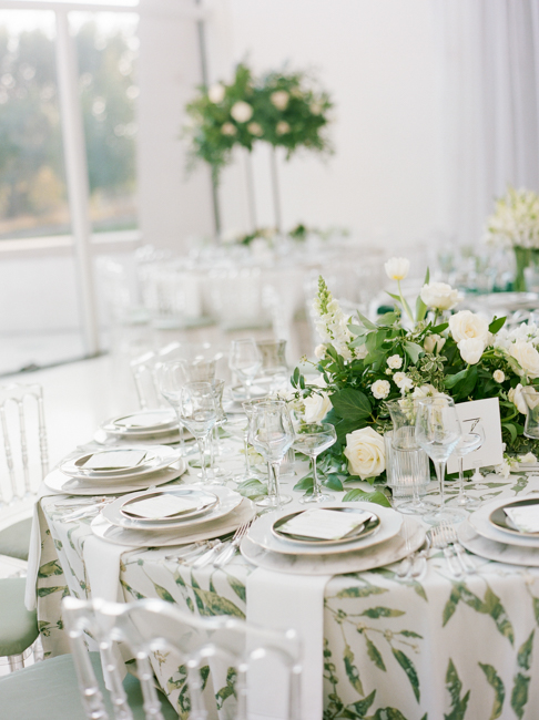 table setup with green and white flowers