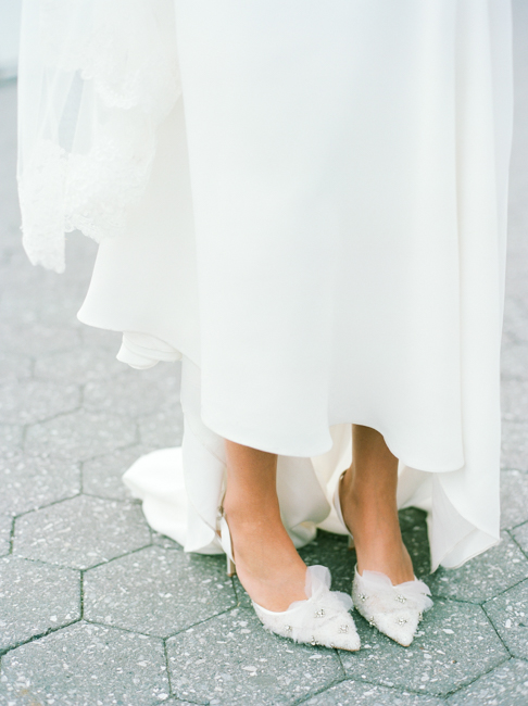 bride in dress showing shoes