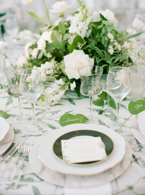 table setup with green and white flowers