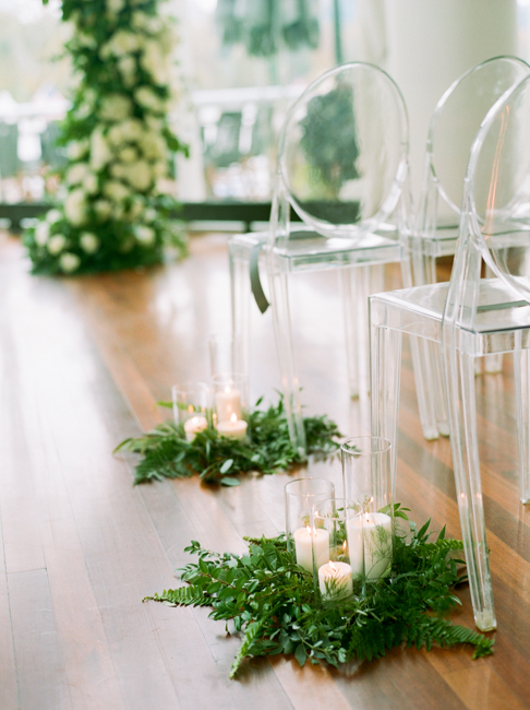 clear chairs and greenery