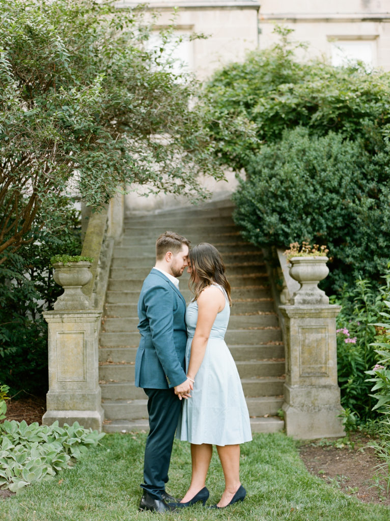 couple embrace during their engagement session at The Washington National Cathedral