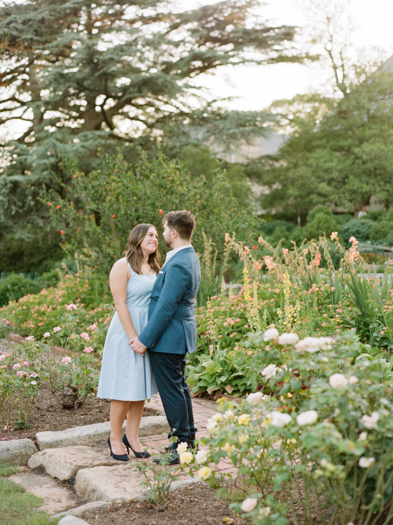 couple embracing in the garden during their engagement session in washington DC